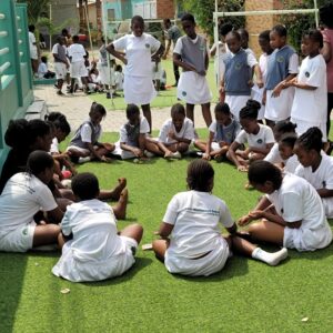 Oasis international students sitting in a circle, playing a game